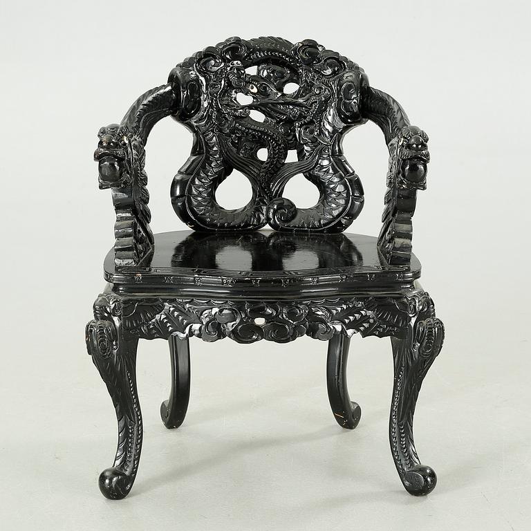 A Japanese 20th century arm chair.