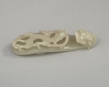 Two pale green nephrite garment hooks, Qing dynasty.