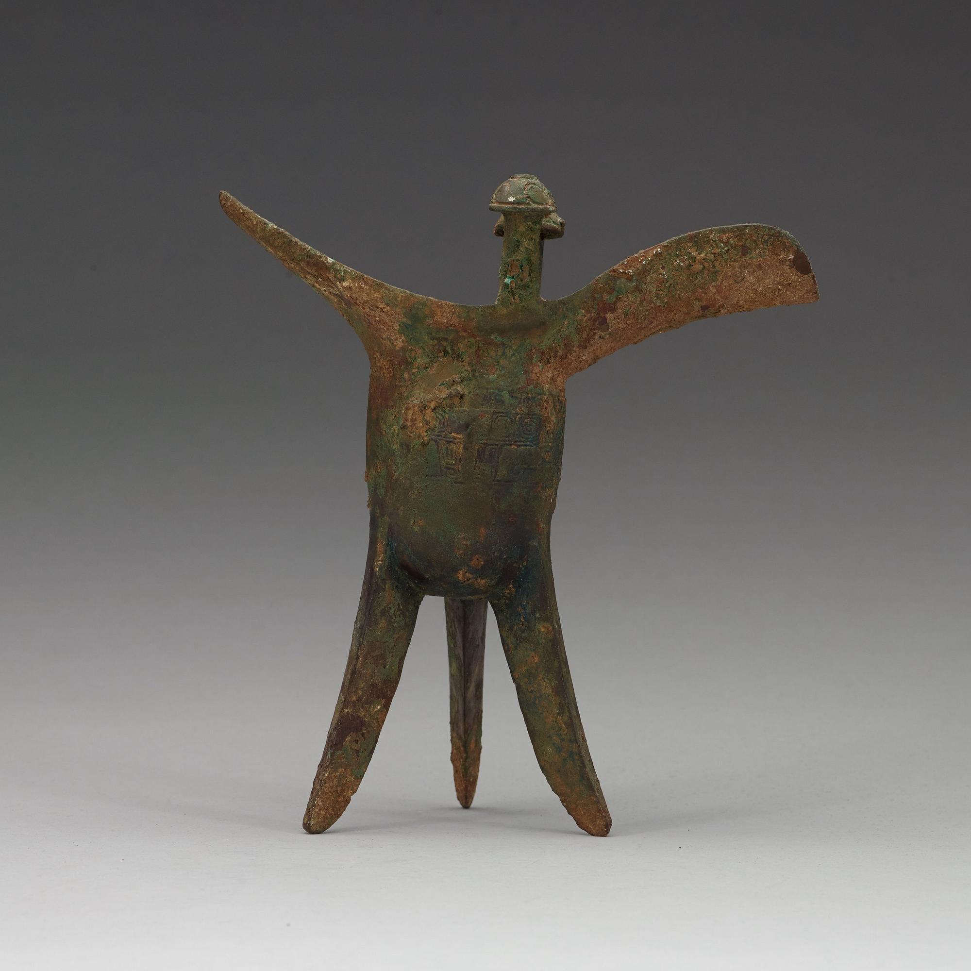 A bronze ritural tripod wine vessel 'Jue', presumably Shang dynasty, 12/11th Century BC.