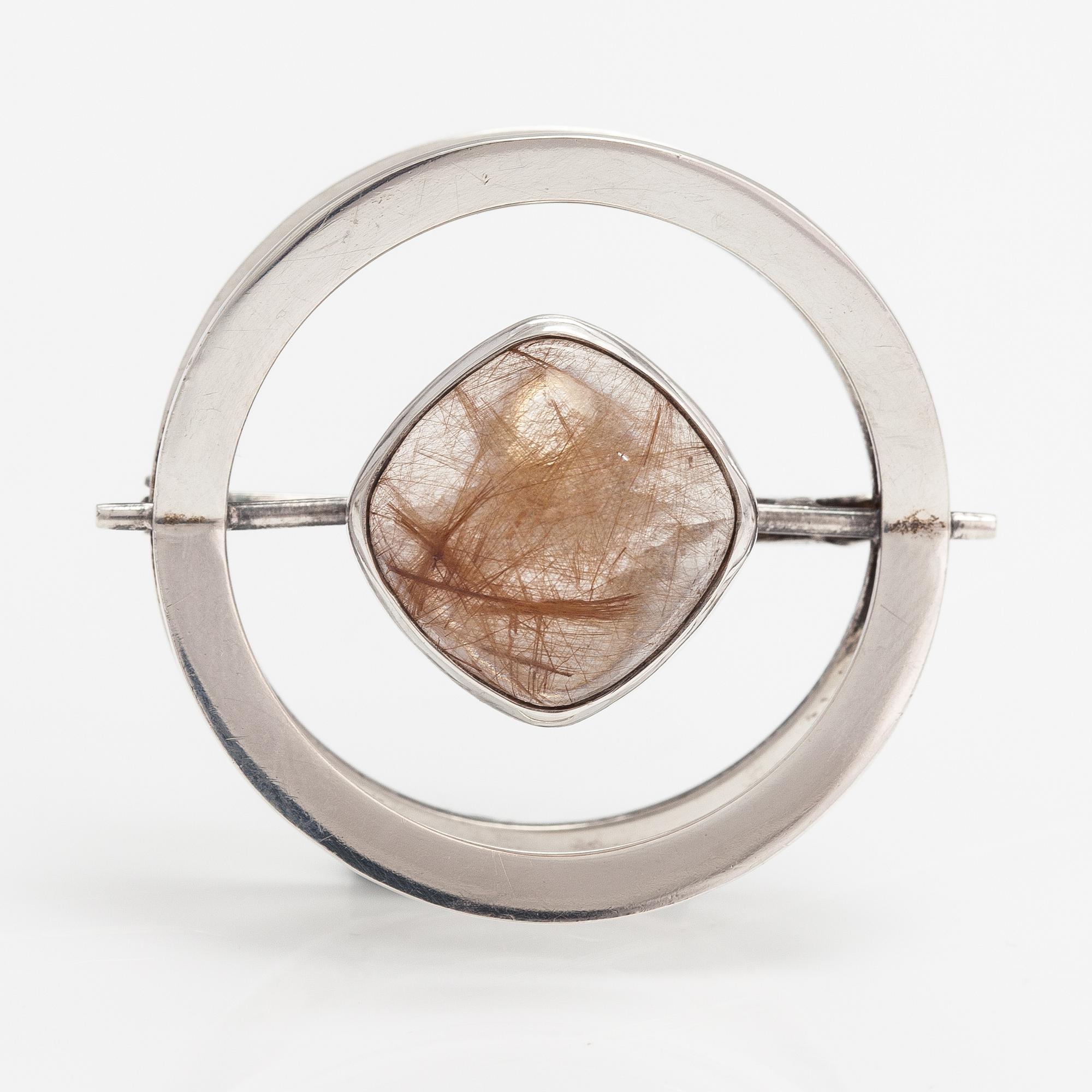 Elis Kauppi, A silver brooch/pendant with a rutile quartz. Kupittaan kulta, Turku 1961.