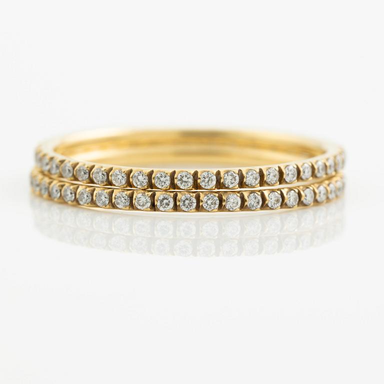 Ringar, Georg Jensen. ett par, "Signature", 18K guld med briljantslipade diamanter.