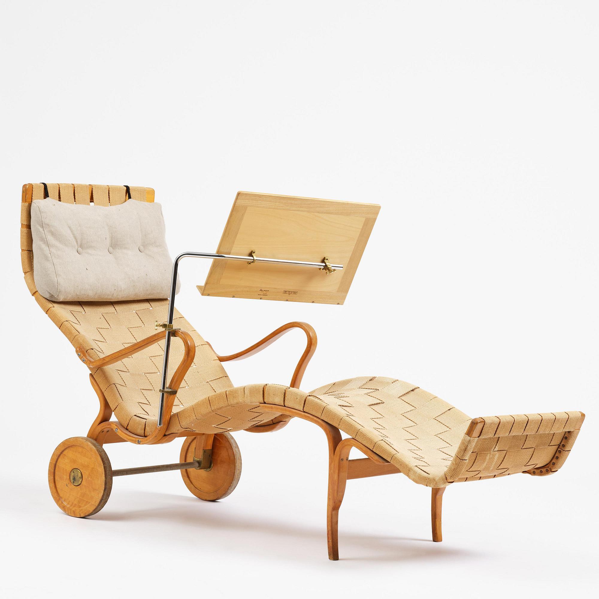 Bruno Mathsson, a lounge chair with wheels, Firma Karl Mathsson, Värnamo, 1940s, with reading table from 1972.