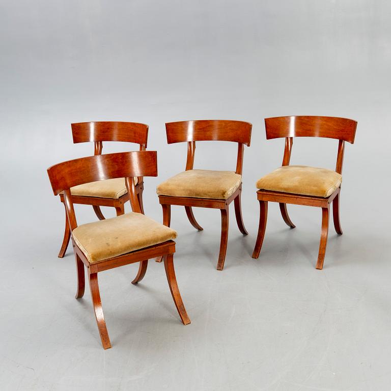 A set of four mahogany chairs around 1900.