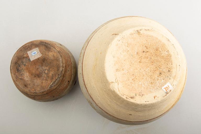 Two olive green glazed South East Asian jars, 14th/17th Century.