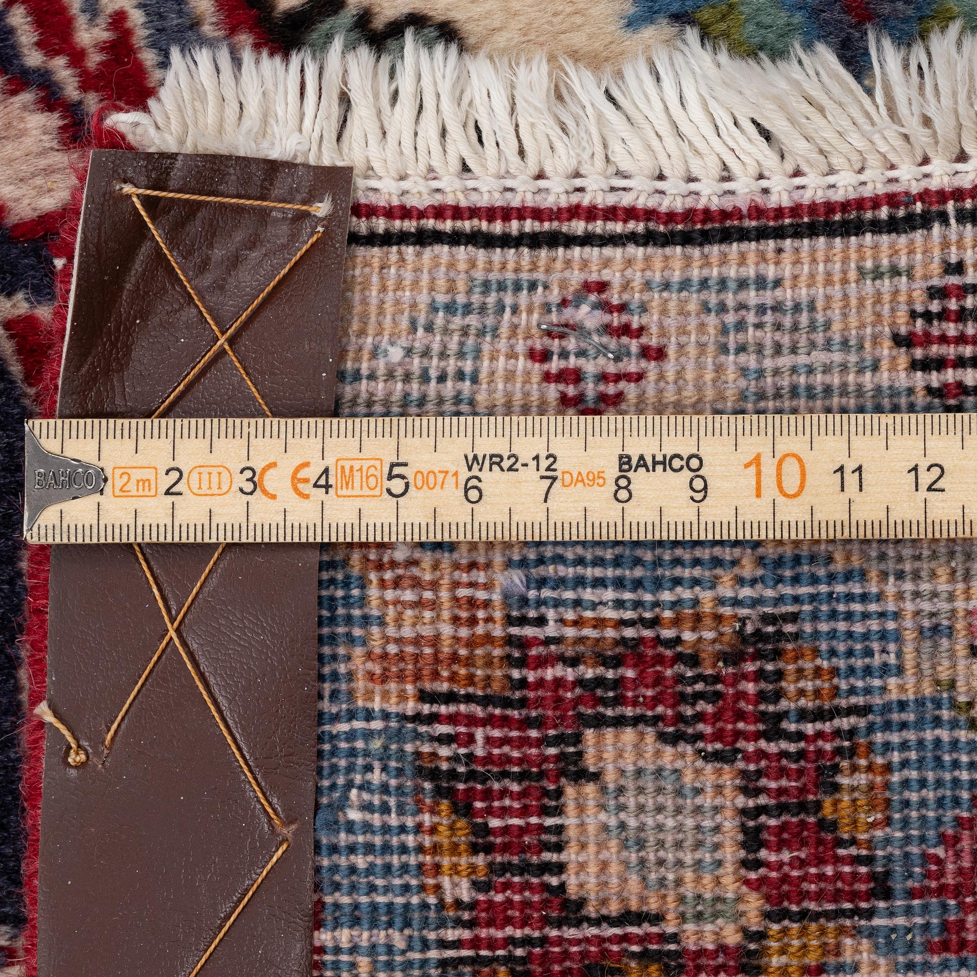 An oriental carpet, a. 419 x 295 cm.