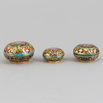 Three small boxes, two eggs and a bell, enamel, probably China, second half of th 20th century.