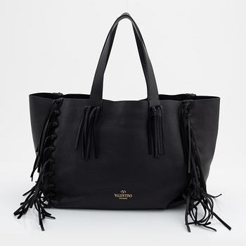 Valentino Garavani, a black leather fringe bag.