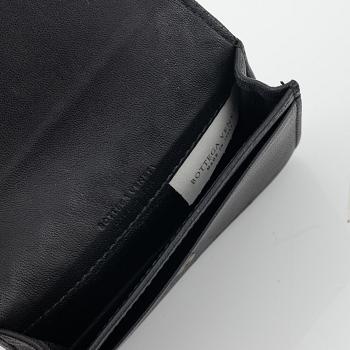 Bottega veneta, a black leather key case and wallet.