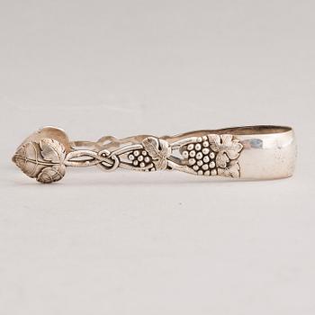 A silver sugar tong and a 3-piece silver coffee set, mark of Juho H. Pekuri, Oulu 1931 and Finnish import marks 1938.