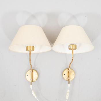 A pair of Belid brass wall lamps later part of the 20th century.