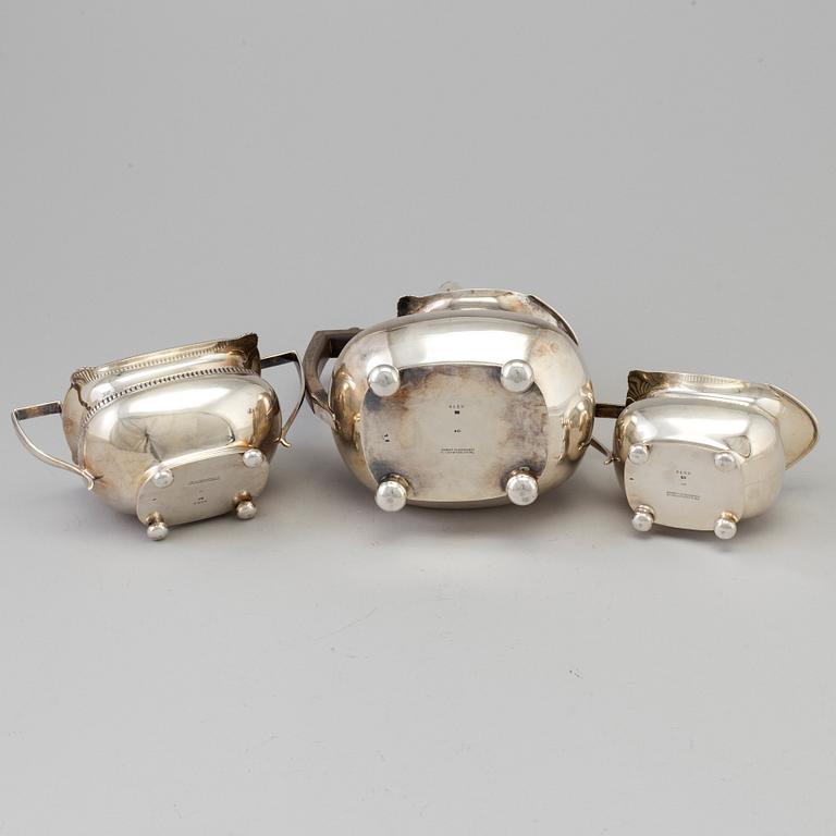 A three piece silver coffee set by The Alex Clark Company, London, first half of the 20th century.