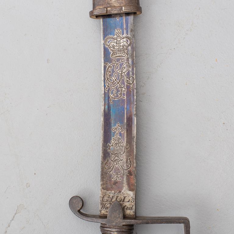 A british sabre with scabbard circa 1800.