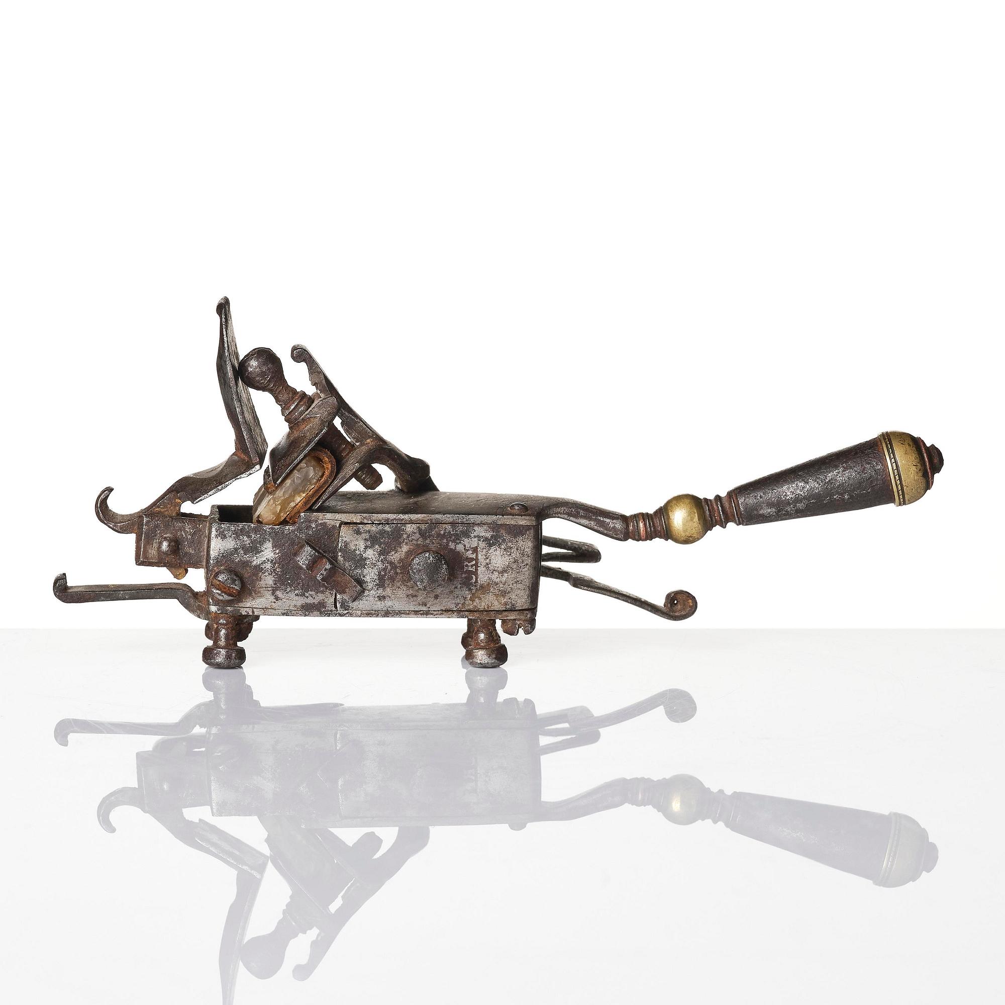 A mechanical flintlock igniter, later part 18th century/early19th century.