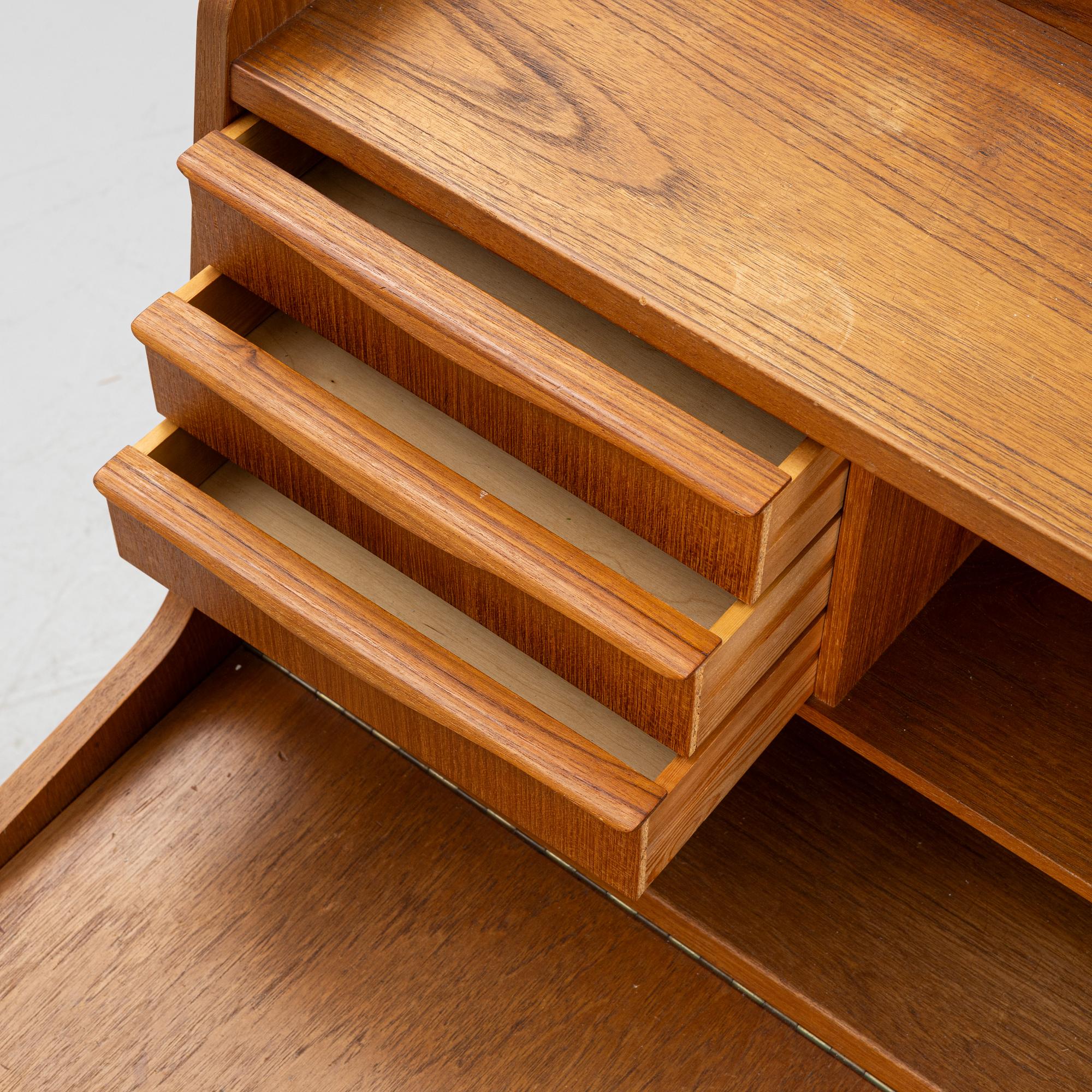A teak writing desk, 1950-60s.