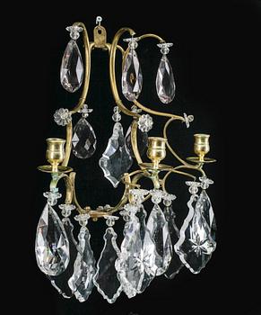 VÄGGLAMPETTER, ett par, rokokostil, omkr år 1900.