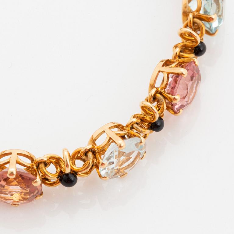 A WA Bolin bracelet in 18K gold set with coloured gemstones.