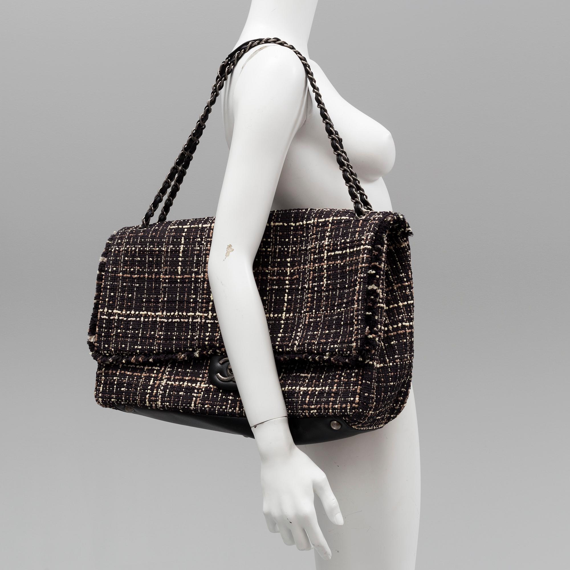 A tweed bag "Classic flip bag XL" by Chanel from 2016-2017.
