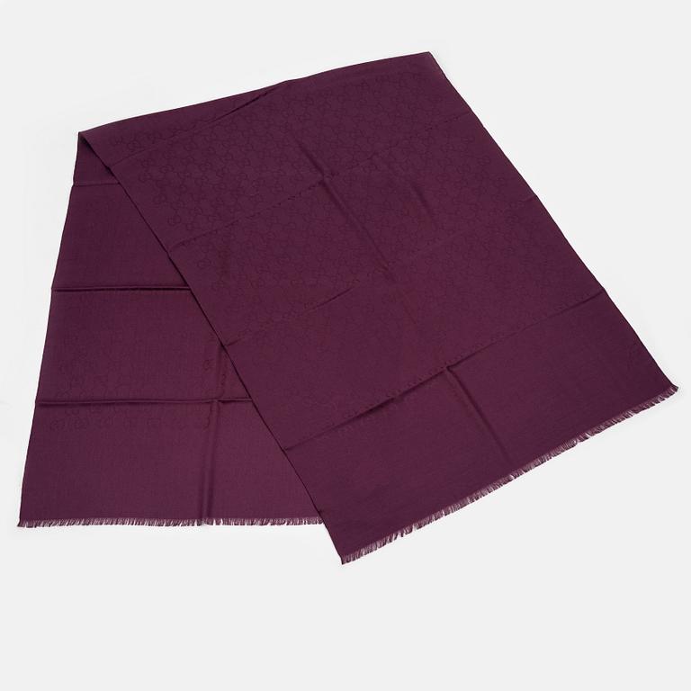 Gucci, a wool and silk mix "GG" jaquard shawl.