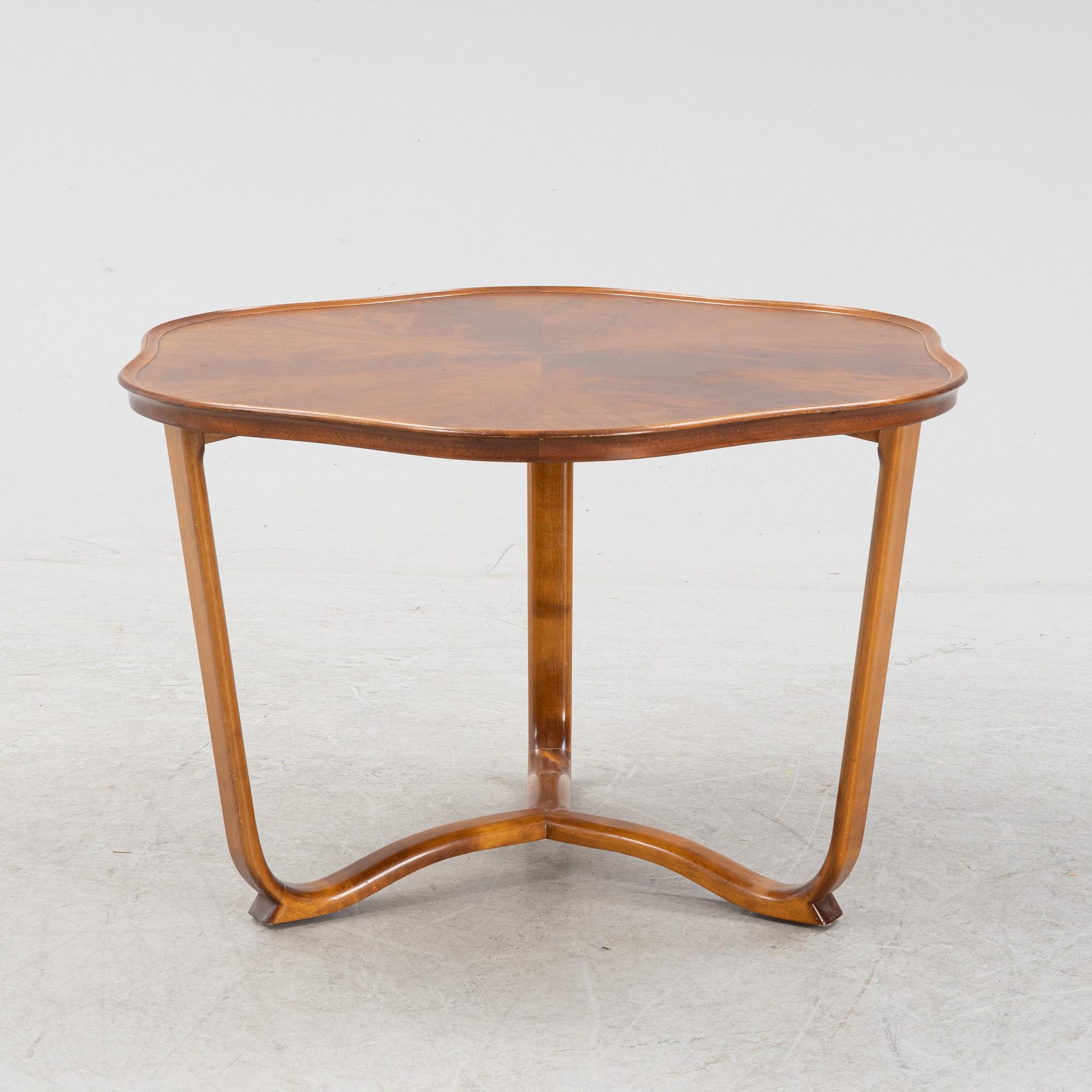 A 1940s mahogany coffee table.