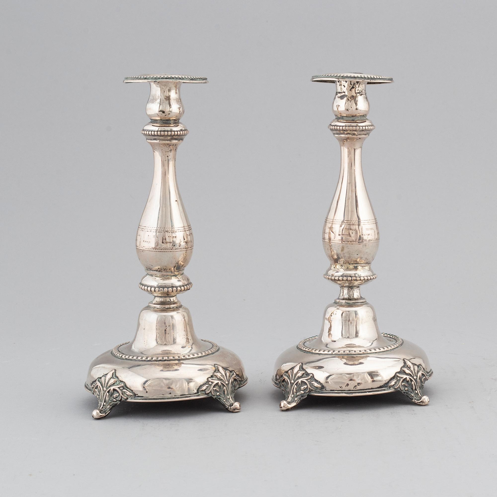 A pair of silver candlesticks, circa 1900.