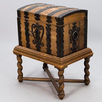 A oak baroque chest on a later leg frame.