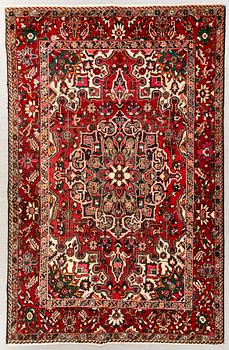 An old bachtiari carpet ca 310x210 cm.