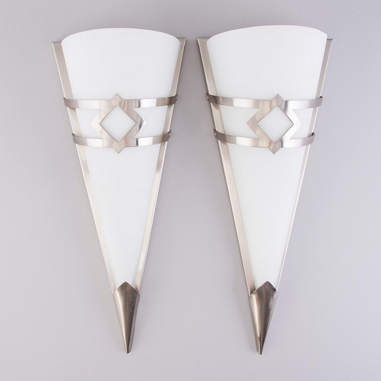 A pair of Swedish wall lamps in glass and metal by LampGustaf AB, late 20th Century.