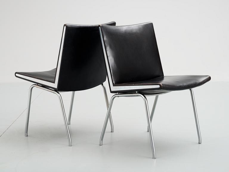 A pair of Hans J Wegner 'Kastrup' steel and black leather chairs, AP-stolen, Denmark.