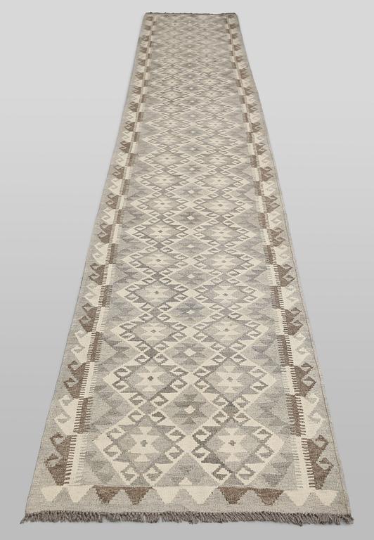 A Kilim runner carpet, c. 486 x 78 cm.