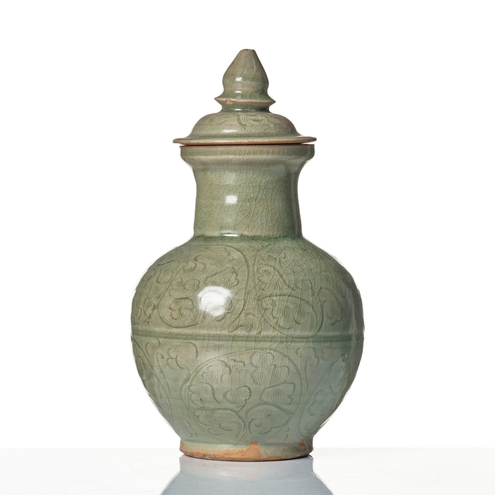 A celadon glazed jar with cover, Yuan dynasty (1271-1368).