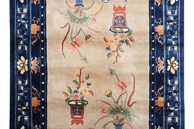 A rug, China, antique finish, ca 206 x 117 cm.