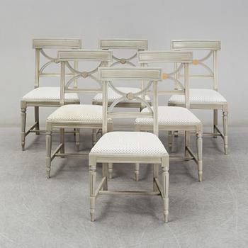A dining table and six chairs, Gustavian style, second half of the 20th century. One leaf included.