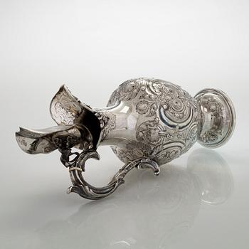 A sterling silver jug, maker's mark of Martin, Hall & Co, Sheffield 1877.