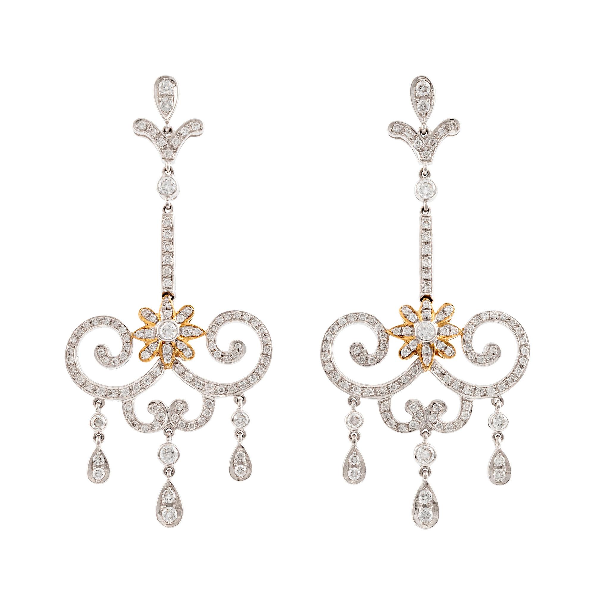 A pair of 18K white gold and round brilliant cut diamond chandelier earrings.