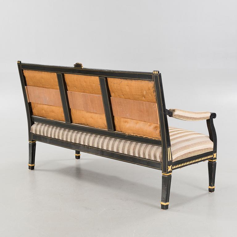 A gustavian style table and sofa, around the year 1900.