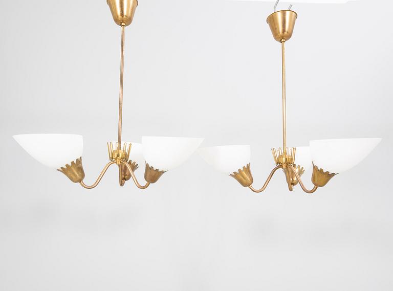 A pair of  ASEA Belysning brass 1950s ceiling pendants.