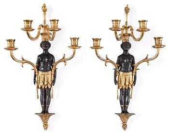 603. A pair of Empire-style circa 1900 four-light wall-lights.