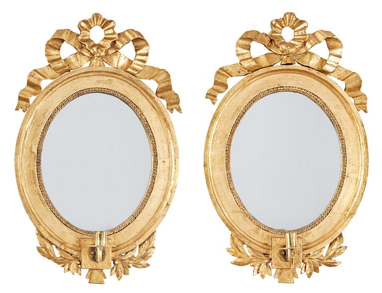 A pair of Gustavian late 18th century one-light girandole mirrors.