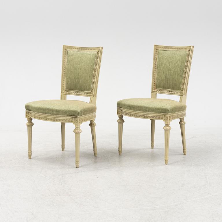 A Gustavian dining table with six chairs. Åmells dated 1974.