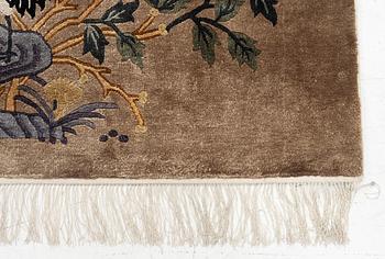 A silke figural rug, China, later part of the 20th century, ca. 92 x 170 cm.