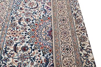 A Nain carpet, part silk, 9 laa, c. 293 x 199 cm.