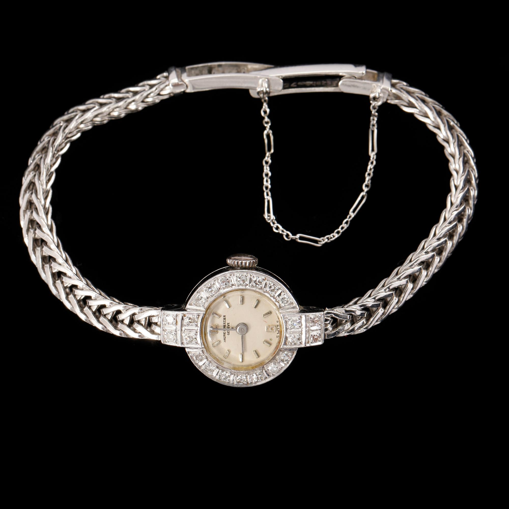 DAMARMBANDSUR, vitguld 18K, med 22 diamanter. Baume & Mercier, Geneve. Svensk importstämpel. Tot ca 21 gram.