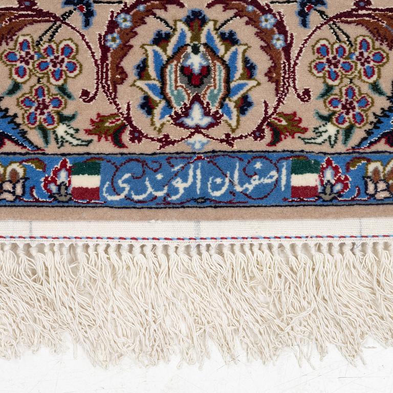 An Isfahan rug, signed, approx. 168 x 108 cm.