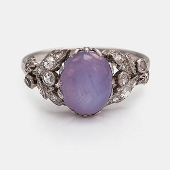 Oskar Pihl, A platinum ring with a ca. 4.0 ct star sapphire and rose-cut diamonds ca 0.12 ct in total. A Tillander 1930s.