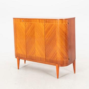 A 1940s teak and mahogany sideboard/cabinet.