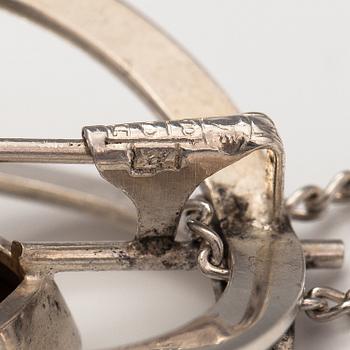 Elis Kauppi, A silver necklace/brooch with a tiger's eye. Kupittaan kulta, turku 1961.