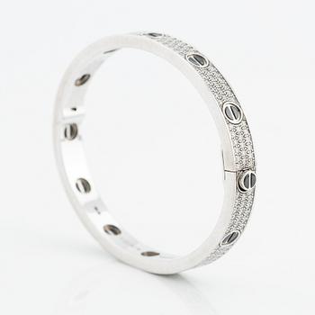 An 18K white gold Cartier bracelet "Love" with round brilliant-cut diamonds and ceramic.