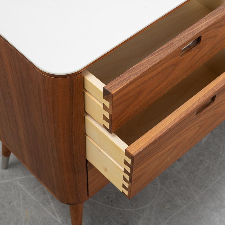 A pair of AK 2410 bedside dressers by Nissen & Gehl for Naver Collection.