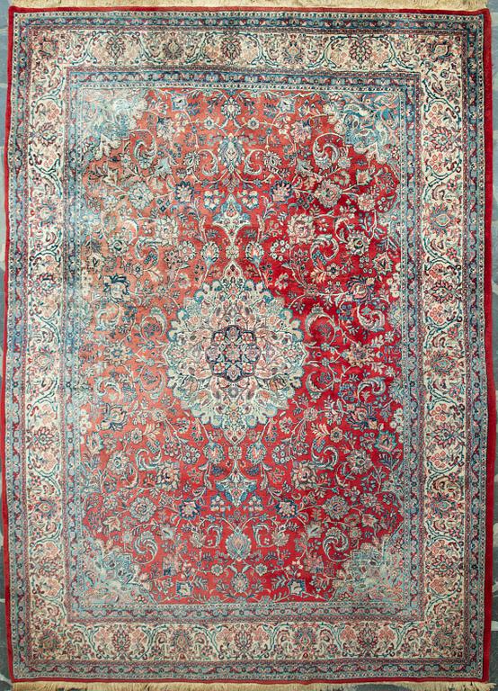 A carpet from Turkey. Circa 383x277 cm.