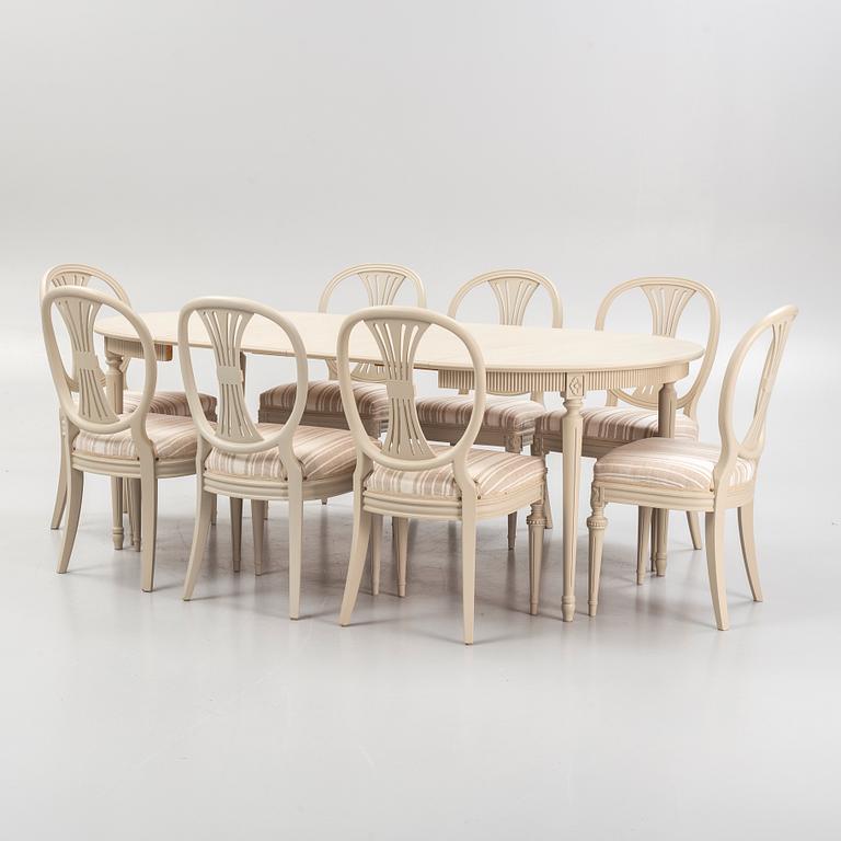 A Gustavian style dining table and eight chairs, late 20th Century.